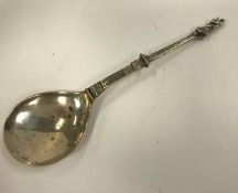 An early Continental Apostle spoon with peardrop bowl and dragon scale decorated handle,