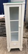 A modern cream glazed door free standing cabinet and a cream painted floral decorated hanging