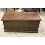 A 19th Century oak trunk, the plank top with applied moulded edge over plain sides,
