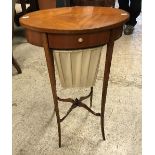 A 19th Century mahogany and inlaid Sheraton Revival sewing table of oval form with single drawer
