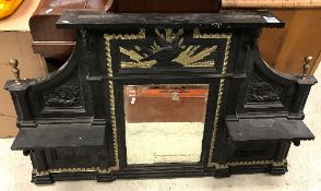 A Victorian cast iron overmantel mirror with central eagle and sunburst relief work panel over a