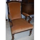 A Victorian rosewood framed upholstered open arm elbow chair with shepherd's crook arms,