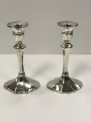 A pair of Edwardian silver candlesticks (by Daniel & Arter Birmingham 1906? marks rubbed), 17.