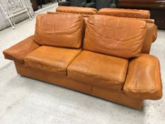 A Burov orange leather upholstered sofa,