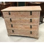 A 19th Century Continental pitch pine commode of four long drawers with aesthetic style brass drop