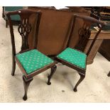 A set of four circa 1900 mahogany dining chairs in the Chippendale style together with two similar