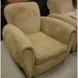 A pair of early to mid 20th Century upholstered club type armchairs with scroll arms on plain heavy