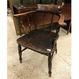 A set of eight early 20th Century stained beech and elm smoker's bow chairs with spindle backs and