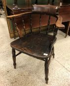 A set of eight early 20th Century stained beech and elm smoker's bow chairs with spindle backs and