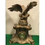 A circa 1900 gold painted spelter mantel clock with spreadeagle surmount (modern movement),