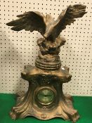 A circa 1900 gold painted spelter mantel clock with spreadeagle surmount (modern movement),