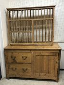 A Victorian pine dresser with two deep drawers and cupboard door 143 cm wide x 61 cm deep x 88.