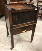 A George III mahogany tray top night table with tambour front compartment over a single drawer,