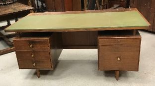 A mid 20th Century teak double pedestal desk,