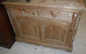 A modern Continental pine side cabinet,