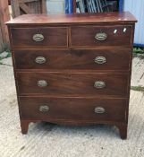 A Victorian mahogany and inlaid chest of two short over three long drawers