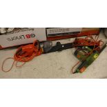 A collection of electric garden tools to include rotivator, chainsaw, hedge trimmer,