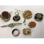 A collection of Victorian and other yellow metal brooches,
