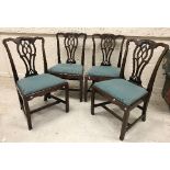 A set of four 18th Century mahogany dining chairs in the Chippendale manner,