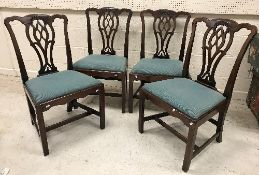 A set of four 18th Century mahogany dining chairs in the Chippendale manner,