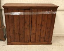 A circa 1900 stained pine cupboard,