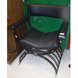 A mid 20th Century black painted wrought iron X framed chair with upholstered back panel,