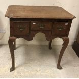 A George III North Country English oak and cross banded lowboy,