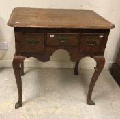 A George III North Country English oak and cross banded lowboy,