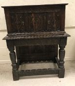 An oak court cupboard in the 17th Century style,