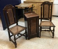 A pair of circa 1900 oak and caned hall chairs in the 17th Century manner together with a late