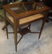 An Edwardian mahogany Sheraton Revival bijouterie table with rising lid,