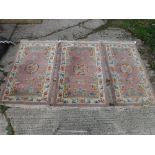 A set of three Chinese rugs,