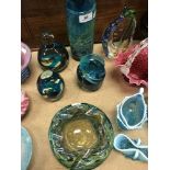 A collection of Mdina glass to include tubular vase, 20 cm high, two paperweights and wavy bowl,
