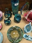 A collection of Mdina glass to include tubular vase, 20 cm high, two paperweights and wavy bowl,