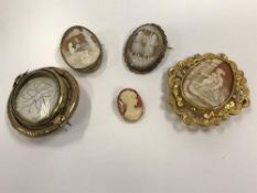 Four various gold / yellow metal mounted cameo brooches,