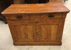 A 19th Century French painted pine buffet decorated in faux light oak,