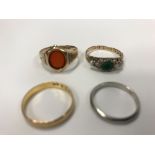 A 22 carat gold wedding band, 2 g, a 15 carat gold, emerald and pearl set dress ring, 1.