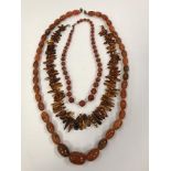 A graduated oval amber bead necklace, approx 74 cm long, 65 g,