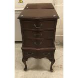 A pair of modern mahogany sepentine fronted bedside chests of four drawers in the Georgian style,