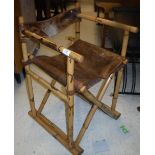 A pair of vintage bamboo framed and leather seated folding chairs 74 cm high x 46 cm deep