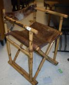 A pair of vintage bamboo framed and leather seated folding chairs 74 cm high x 46 cm deep