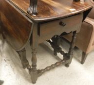 A 19th Century oak oval gate-leg drop-leaf dining table in the 17th Century manner,