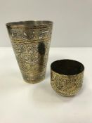 An Indian silvered brass and engraved goblet with Sanskrit decoration, 11 cm high,