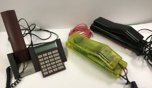 A Bang & Olufsen Beocom 2400 phone and two Swatch twin phones