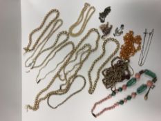 A collection of costume jewellery to include various necklaces, brooches, bangles, etc,