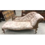 A Victorian walnut framed chaise longue,