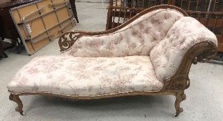 A Victorian walnut framed chaise longue,