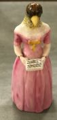 A Royal Worcester candle snuffer as a singing bird headed woman "Diffidence",