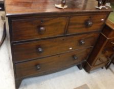 A Victorian mahogany chest of two short over two long drawers with knob handles,