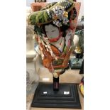 A modern Japanese fabric covered and painted bat depicting a geisha,